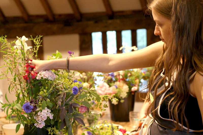 Wedding flower workshop - Lizzie concentrates on making up an arrangmement to decorate a beam at my recent wedding flowers workshop at St Nicolas Place, Birmingham