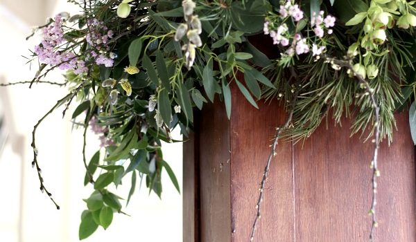Wedding flowers season begins wild and leafy arrangement for wedding pillars using seasonal spring flowers and foliage. Tuckshop Flowers, Birmingham